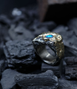 Sertie d'une Opale cette bague en argent massif et or