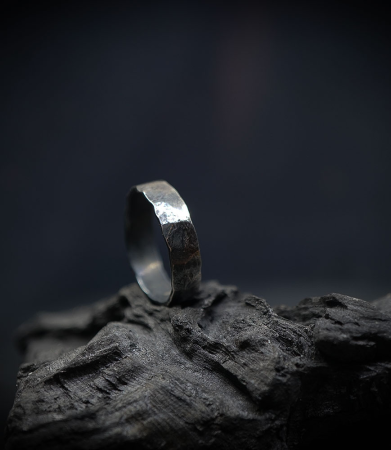 Hammered solid silver ring created by Anthony Barrouyer.