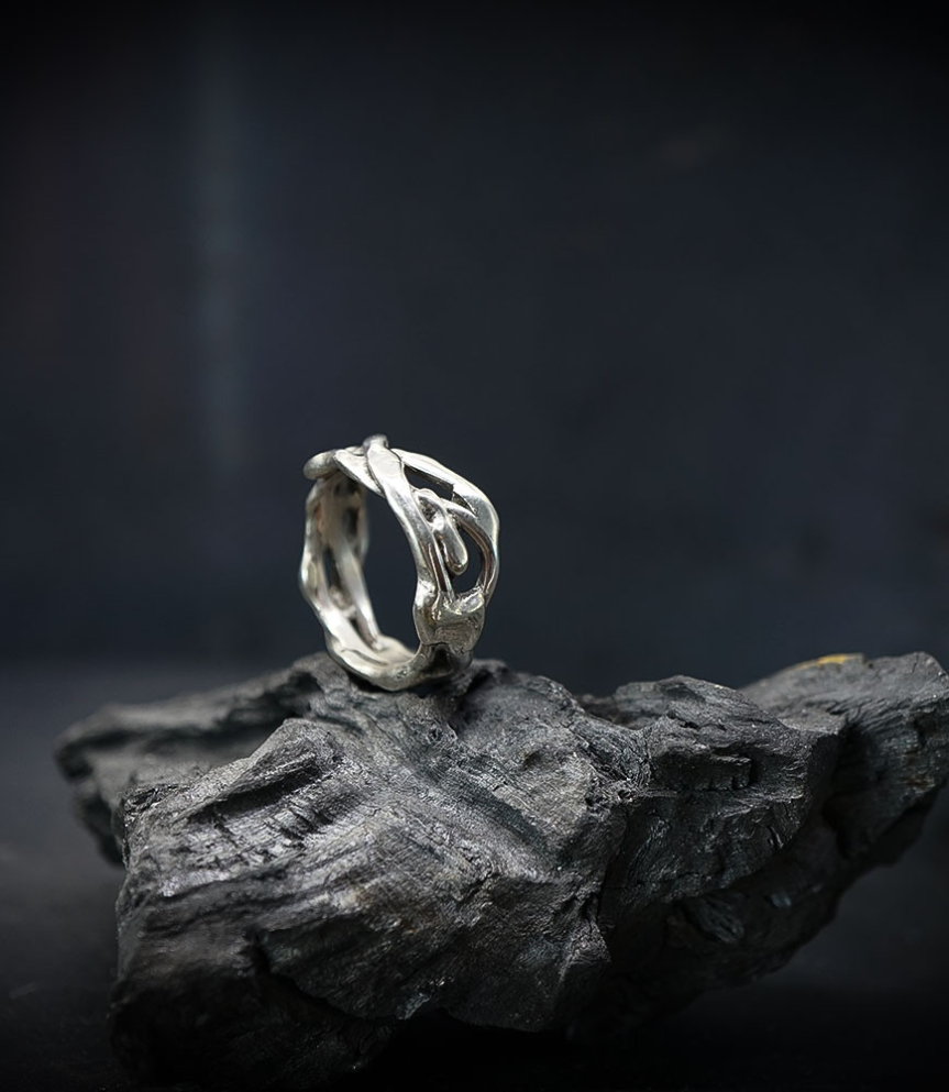 Solid silver ring.